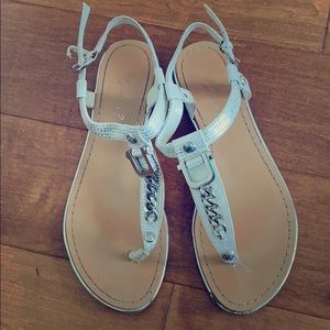 Nacre Guess sandals with python pattern